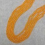 Orangene, transparente tschechische Kristall-Rondell-Perlen, facettiert, Durchmesser 6x5 mm, Länge ca. 41 mm, auf Monofilamentfaden
