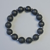Schungit-Armband (künstlich) glatte Kugeln, Durchmesser ca. 12 mm, Elastikband, Länge ca. 18 cm, mit Hämatit-Einsätzen