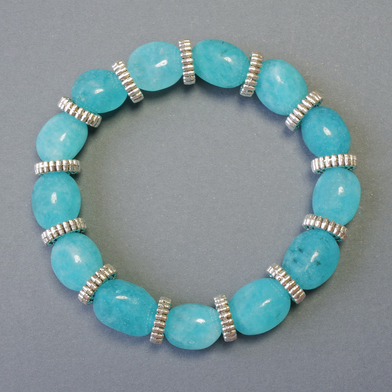 Armband aus Aquamarin, natürlicher Stein, facettierte Perlen, Durchmesser ca. 9×12 mm, Stretcharmband, Länge ca. 18 cm, mit Metall-Einsätzen