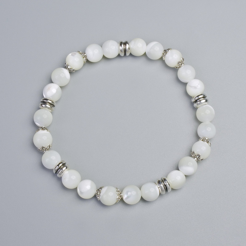 Perlmuttarmband, glatte Kugeln, Durchmesser ca. 7,5 mm ± (Stretch), Länge ca. 18 cm ±, mit Metall-Einsätzen
