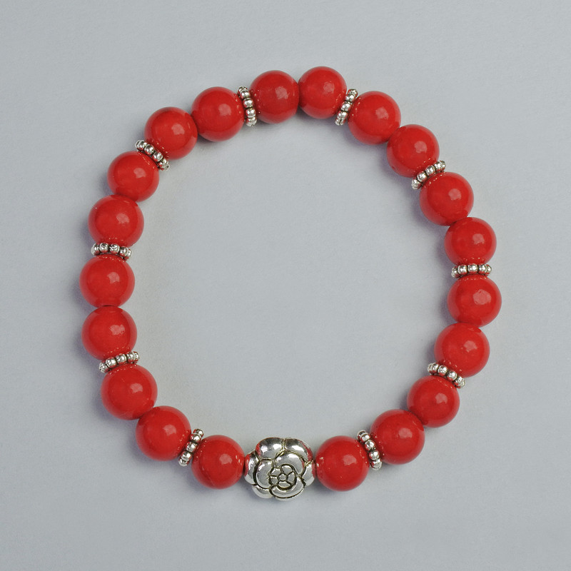 Korallenarmband (gepresst) glatte Kugeln, Durchmesser ca. 8 mm, Elastikband, Länge ca. 18 cm, mit Metall-Einsätzen