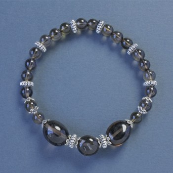 Armband aus Rauchtopas-Kügelchen, Ø 6 mm ±, facettierte Elemente 10 × 12 mm ±, Länge ca. 18 cm ±, Stretch-Armband mit Einsätzen