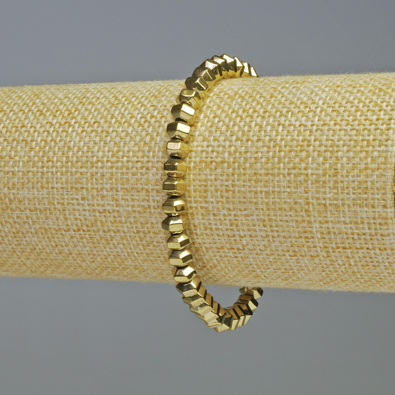 Armband aus facettierten Hämatit-Rondellen in Goldfarbe, Durchmesser 6×4 mm, Länge ca. 18 cm, Stretch