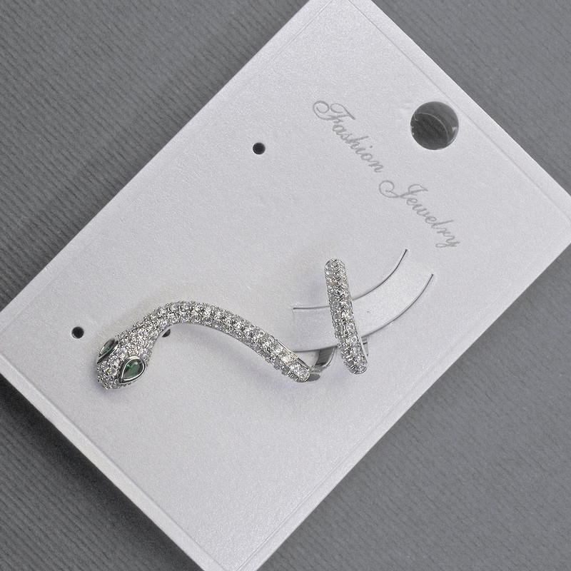Ohrclip „Schlange“ aus silberfarbenem Metall, 14×30 mm ± weiße und grüne Strasssteine