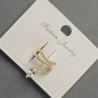 Ohrclip 'Schlange' aus goldfarbenem Metall, 12 × 14 mm +- weiße Strasssteine