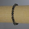 Stretcharmband aus Sonnen-Obsidian, facettierte Rhombus-Perlen, Durchmesser 6×5 mm, Länge ca. 18 cm