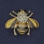 Brosche Biene – goldfarbene und braune Emaille, weiße und schwarze Strasssteine, goldfarbenes Metall, 25×30 mm+