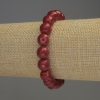 Stretcharmband aus Koralle, facettierte Kugeln Ø ca. 10 mm, Länge ca. 18 cm