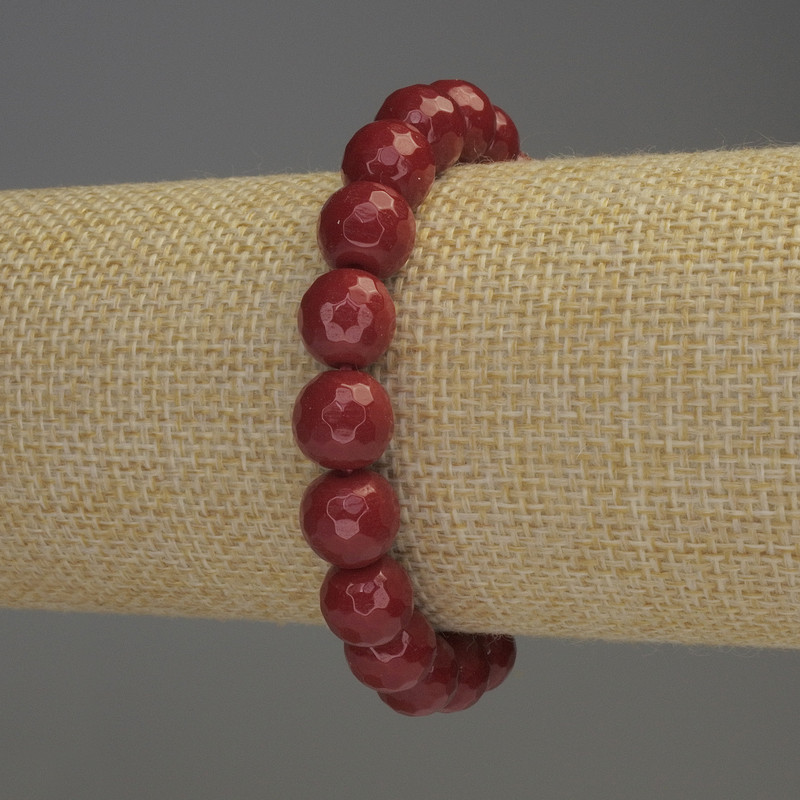 Stretcharmband aus Koralle, facettierte Kugeln Ø ca. 10 mm, Länge ca. 18 cm