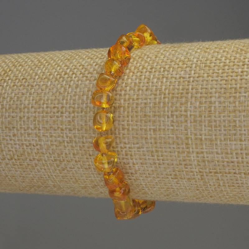 Bernstein-Armband, glatt geschliffen, 7×5 mm, Rocailles ca. 2 mm, Länge ca. 18 cm, Stretch