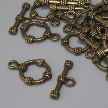 Bronzefarbener Toggle-Verschluss, Ø ca. 19,5 × 3,5 mm; Ring Ø ca. 14 mm; Loch Ø ca. 9 mm; Bronze-Finish; 11 Stück