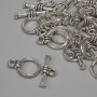 Toggle-Verschluss, Durchmesser 15×3 mm ±, Ringdurchmesser 9,5 mm ±, Lochdurchmesser 7 mm ±, silberfarbener Metallton, facettiert, 15 Stück ±