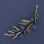 Brosche Ästchen mit blauem Katzenaugenstein, grauen Strasssteinen, 67×26 mm, silberfarbenes Metall