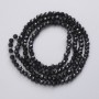 Perlen aus tschechischem Kristall auf Schnur, schwarz matt, facettierte Kugeln, Durchmesser ca. 3 mm, Länge ca. 41 cm
