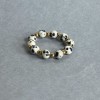 Kugelring aus Dalmatiner-Jaspis, glatte Kugel, Durchmesser ca. 4 mm ± Hematit-Kugel ca. 2 mm ± elastische Schnur