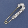Nadelbrosche mit weißen Strasssteinen, 79×20 mm ± goldfarbenes Metall
