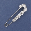 Nadelbrosche mit weißen Strasssteinen, 79 × 20 mm, silberfarbiges Metall