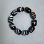 Armband aus Achat in Barrelform, 19 × 15 mm ±, mit Metall-Einsätzen, Länge 18 cm ±, elastisches Band
