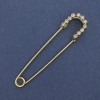 Nadelbrosche mit weißen Strasssteinen, goldfarbenes Metall, 70 × 16 mm ±