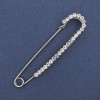 Nadelbrosche mit weißen Strasssteinen, silberfarbenes Metall, 72×17 mm ±