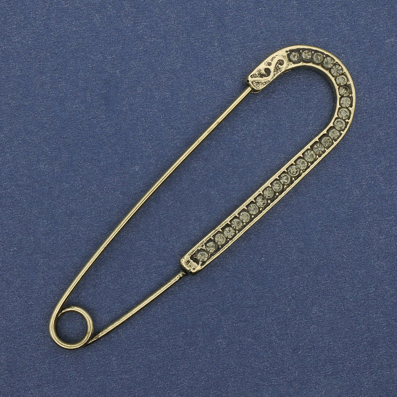 Nadelbrosche mit grauen Strasssteinen, goldfarbenes Metall, Größe ca. 68 × 19 mm