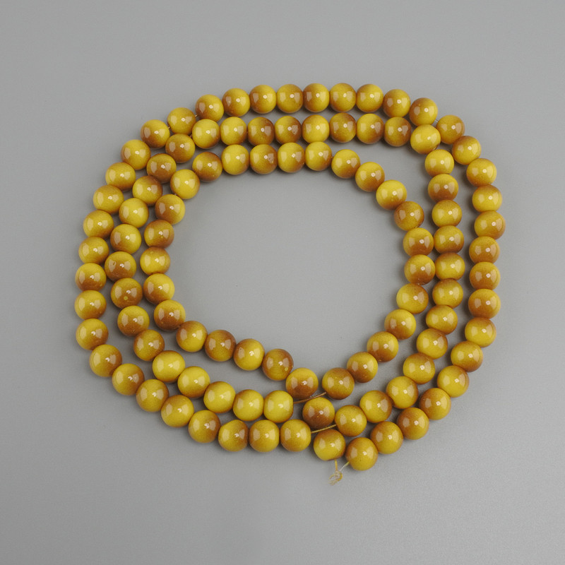 Perlen aus gelbem Tigerauge (künstlich) glatte Kugeln, Durchmesser ca. 8 mm, Länge ca. 80 cm, auf Faden