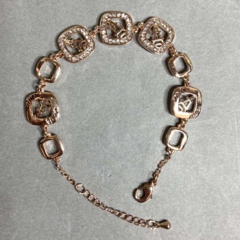 Armband aus goldfarbenem Metall mit weißen Strasssteinen, Durchmesser der dekorativen Elemente 12 mm, Länge 16 mm + 3 cm Verlängerungskette