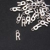 Schmuckzubehör – Anhänger Buchstabe 'R' 17×7 mm Verpackung 20 g (± 25 Stück)