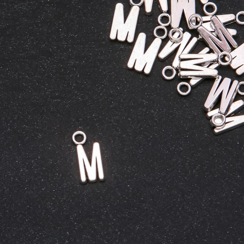 Anhänger in Form des Buchstabens 'M' 17x7 mm, Verpackung ca. 20 g (± 15 Stück)