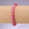 Rosa Katzenauge-Armband mit glatten Kugeln, Durchmesser 8 mm, Länge 18 cm, auf Elastikband