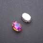Preis pro Packung / 10 Stück. Aufgenähter Kristall in Krappenfassung, oval 10×14 mm, violett-gelb