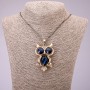 Anhänger »Eule« mit blauen Kristallen auf einer langen Kette aus Metall in der Farbe Schwarzgold, Durchmesser 41×62 mm, Länge 70 cm