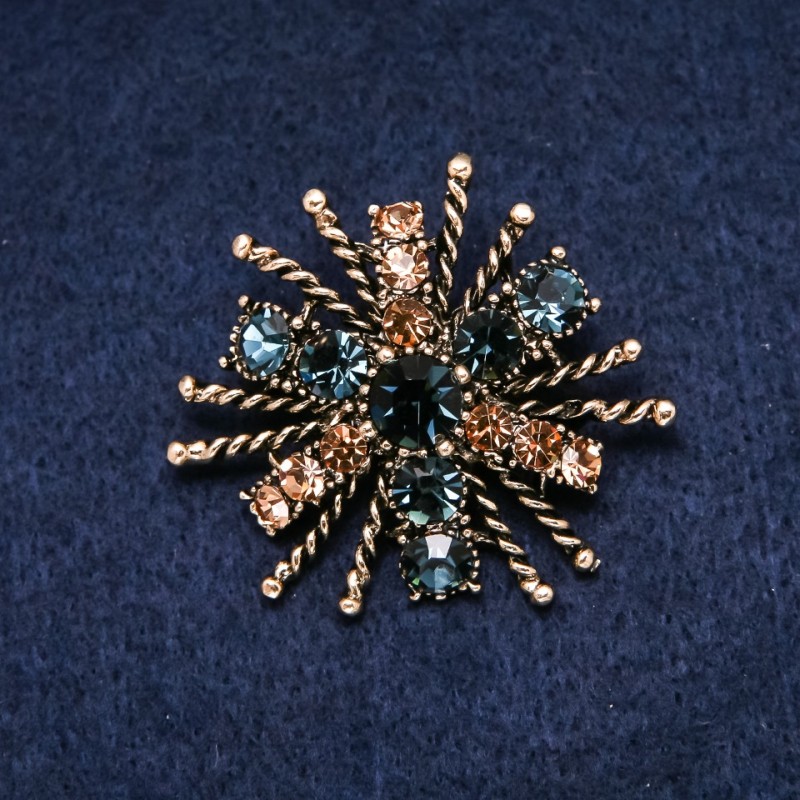 Brosche Orden der Schönheit 45×40 mm, Strasssteine in Gelb und Blau, goldfarbenes Metall