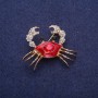 Ausverkauf! Brosche Krabbe rote Emaille und Strasssteine, goldfarbenes Metall 30×40 mm