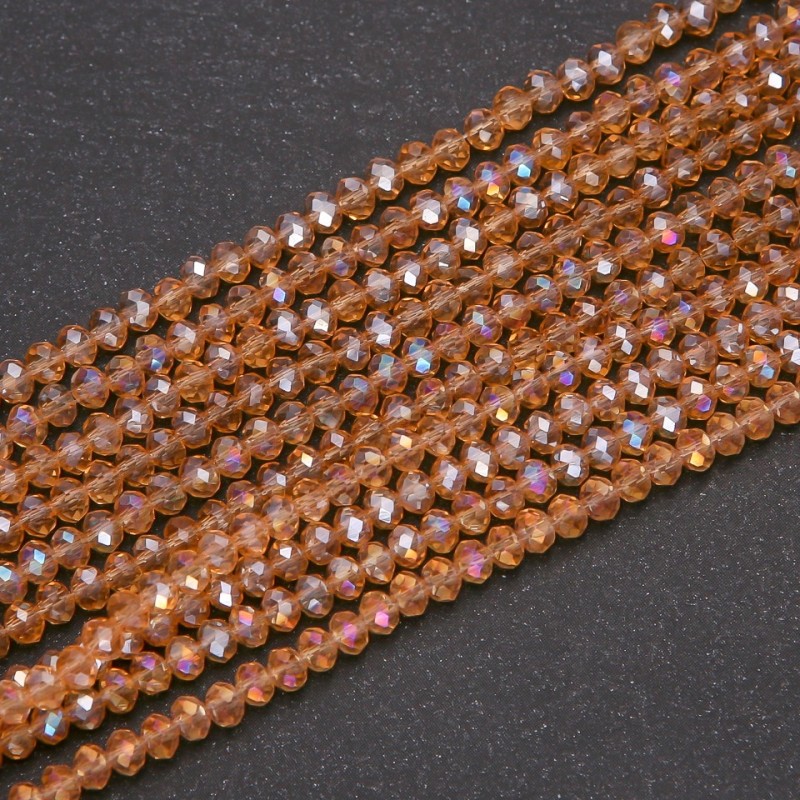 Perlen aus tschechischem Kristall, transparent bernsteinfarben mit Benzin-Finish, Rondell-Form, Durchmesser ca. 3,5 x 3 mm, Schnurlänge 38 cm
