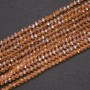 Perlen aus tschechischem Kristall, transparent bernsteinfarben mit Benzin-Finish, Rondell-Form, Durchmesser ca. 3,5 x 3 mm, Schnurlänge 38 cm