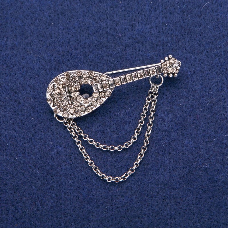 Brosche in Form einer Laute mit grauen Strasssteinen, 17 × 50 mm, silberfarbiges Metall