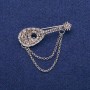 Brosche in Form einer Laute mit grauen Strasssteinen, 17 × 50 mm, silberfarbiges Metall