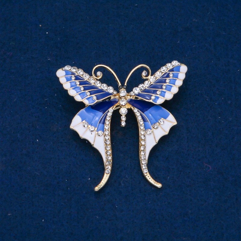 Ausverkauf! Schmetterlingsbrosche mit weißen Strasssteinen, hellblaue, blaue und weiße Emaille, goldfarbenes Metall 48×50 mm +