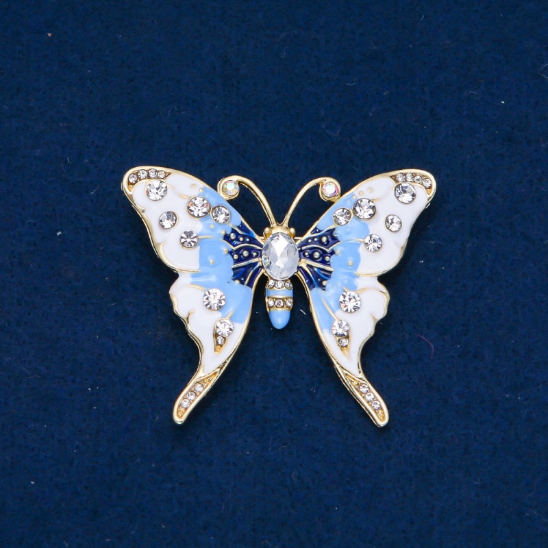 Ausverkauf! Brosche Schmetterling aus goldfarbenem Metall, Emaille und weißen sowie petrolfarbenen Strasssteinen 52 × 42 mm +
