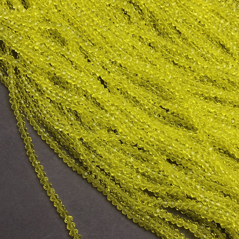 Perlen aus tschechischem Kristall auf Faden – Gelb-transparent facettierte Rondellen, Ø 3 × 2,5 mm, Länge 36–38 cm + -