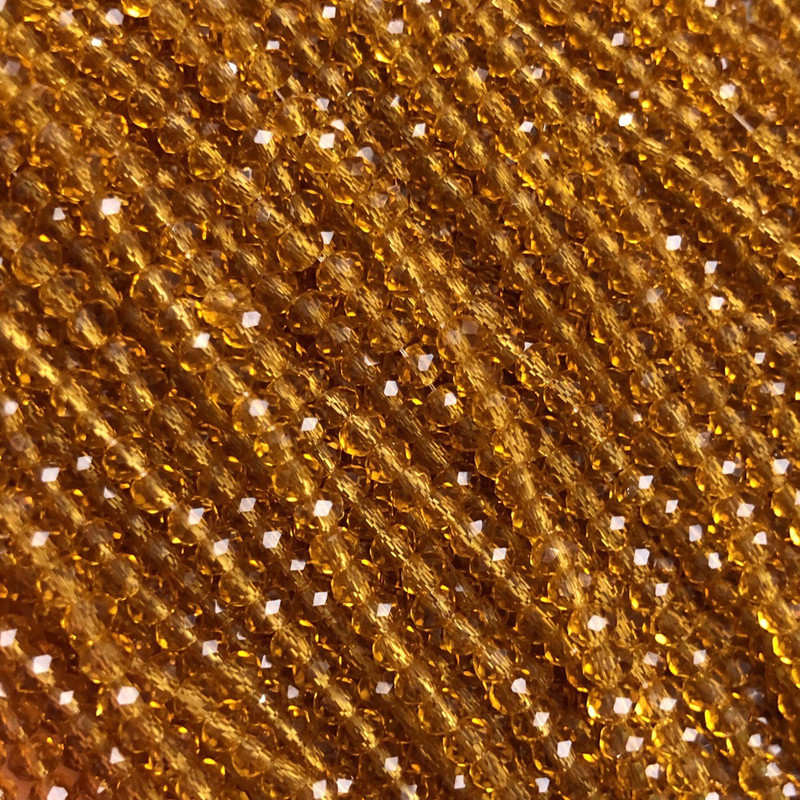 Perlen aus tschechischem Kristall auf Schnur, dunkelgelb honigfarbene transparente facettiertes Rondell, Durchmesser 3,5×3 mm, Länge ca. 36–38 cm