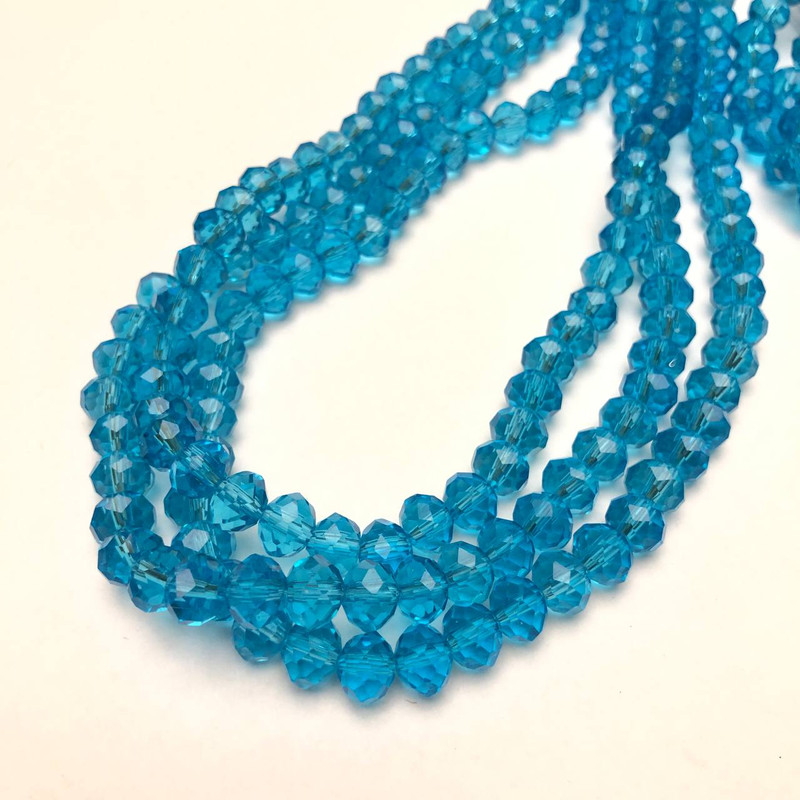 Perlen aus tschechischem Kristall auf Nylonfaden, blau-transparentes facettiertes Rondell, Durchmesser ca. 8 x 6 mm, Länge ca. 40–42 cm +