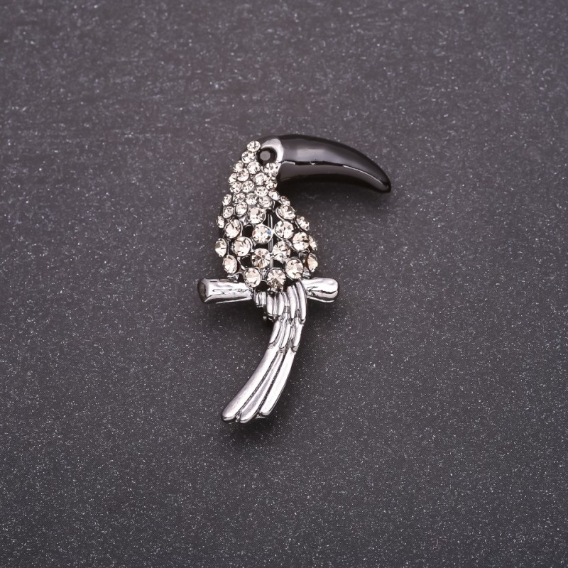 Brosche »Tukan« mit weißen Strasssteinen, schwarzer Schnabel, 38 × 23 mm, graues Metall