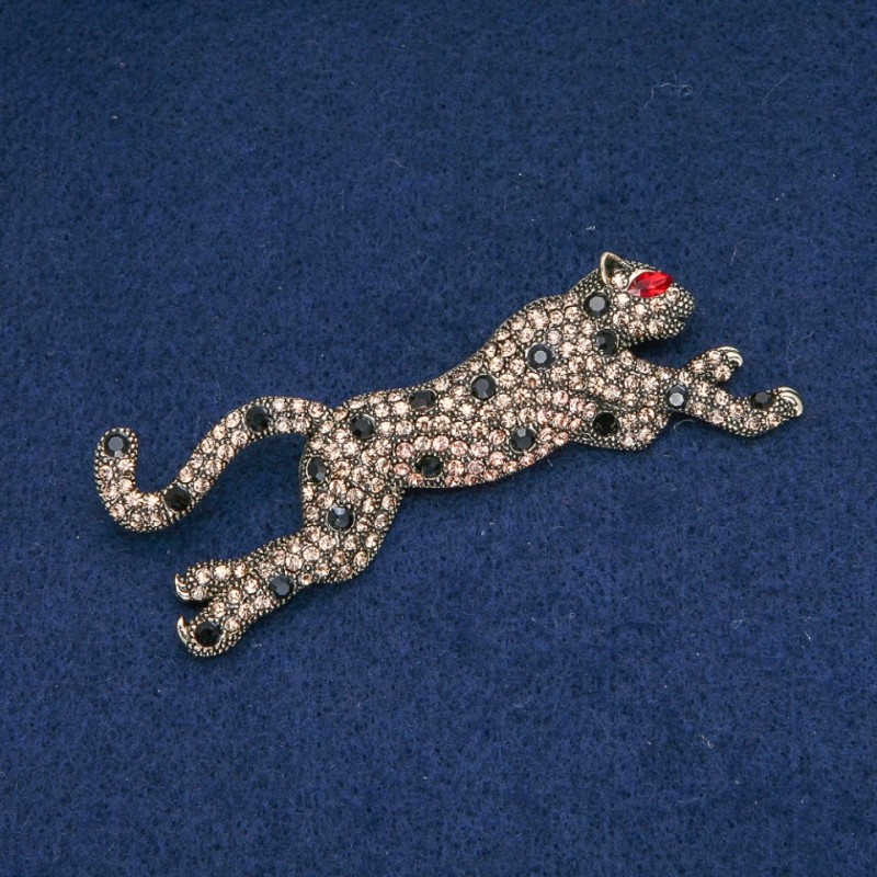 Leopard-Brosche mit goldfarbenen und schwarzen Strasssteinen, goldfarbenes Metall 78 x 30 mm +