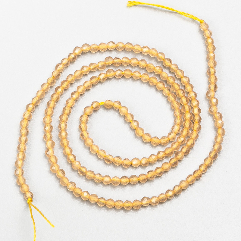 Kleine Spinell-Perlen (synthetisch), beige, facettierte Kugeln, Durchmesser ca. 2 mm, Länge 37 cm, auf Schnur