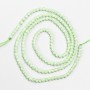 Kleine Spinellperlen (synthetisch), hellgrüne, facettierte Kugeln, Durchmesser ca. 2 mm, auf einer Schnur, Länge 37 cm