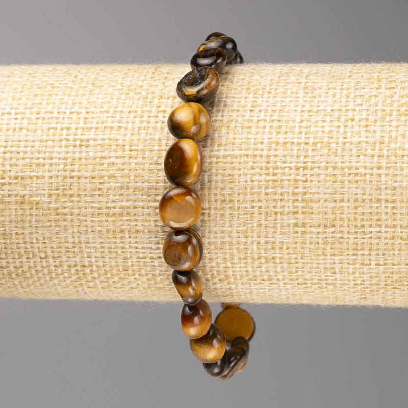 Armband aus Tigerauge, facettierte Kugeln, Durchmesser ca. 8 x 8 mm, auf Elastikband, Länge ca. 18 cm
