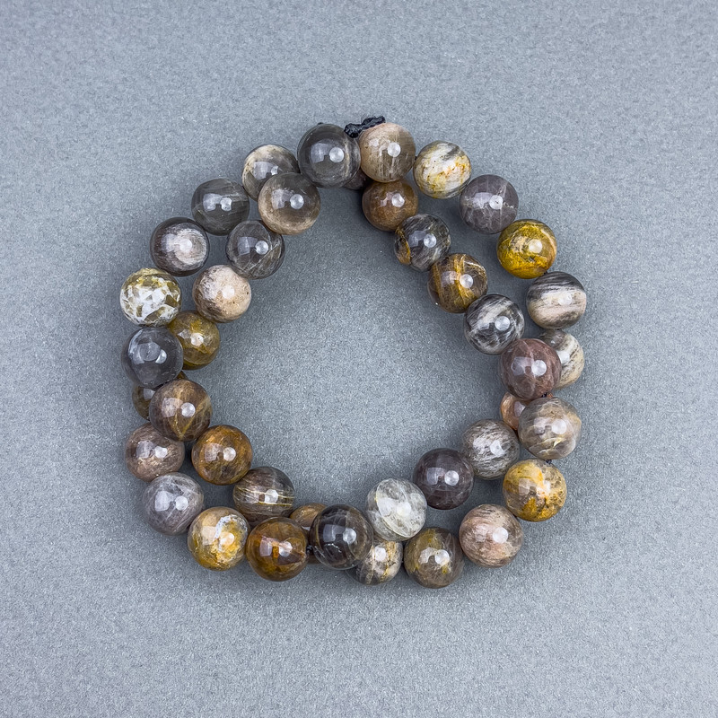 Sonnenstein-Perlen, glatte Kugeln, Ø 9,5 mm ±, auf Faden, Länge ca. 39 cm