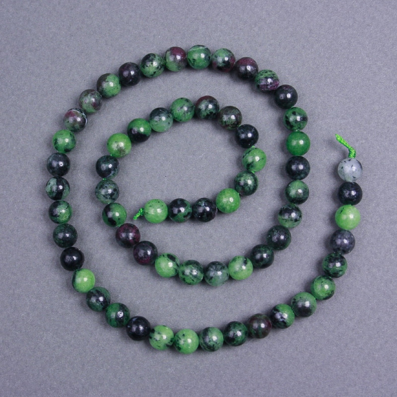 Zoisite-Perlen, natürlicher Stein, glatte Kugeln, Durchmesser ca. 6,5 mm, auf Schnur, Länge ca. 40 cm